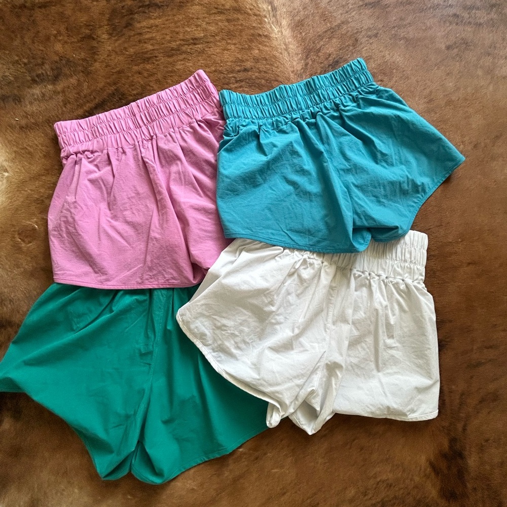 All 4 pair of Mono B Women's Athletic Shorts - Pink, Teal, White, and Turquoise